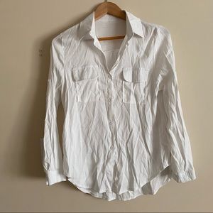 White button down long sleeved Womens shirt.
